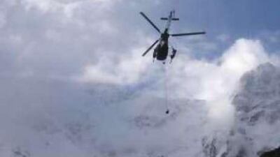 A Pakistani Army helicopter winches the Slovenian climber Tomaz Humar from Nanga Parbat in 2005.