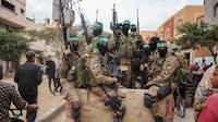 Hamas fighters patrol a street in Gaza. AFP