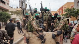 Hamas fighters patrol a street in Gaza. AFP