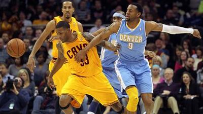 Denver's Andre Iguodala knocks the ball away from Cleveland's Alonzo Gee.
