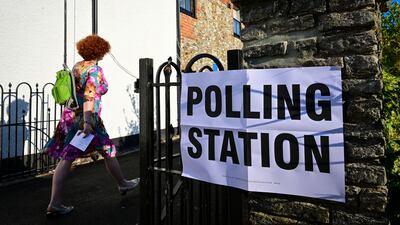 Voters walk to Mackarness Hall in Honiton. The Tiverton and Honiton constituency covers a cluster of villages and market towns surrounded by farmland in Devon. Getty Images