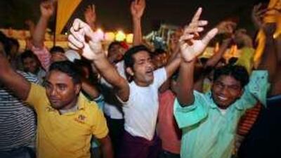Labourers dance at the Camp Ka Champ contest at the Al Nasr Leisureland.