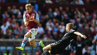 Andreas Weimann of Aston Villa closes down Michael Dawson of Hull City during their Premier League match on Sunday. Clive Mason / Getty Images