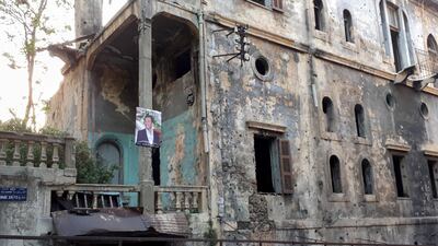 A lonely poster hangs in Basta in Beirut, amid the rubbish and delapidated buildings. India Stoughton