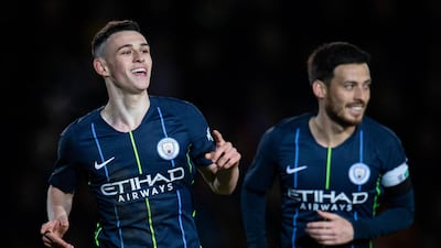 Manchester City midfielder Phil Foden, left, makes the score 2-0. EPA