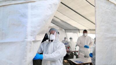 A health worker opens a Covid-19 test centre in Naumburg in eastern Germany. AFP