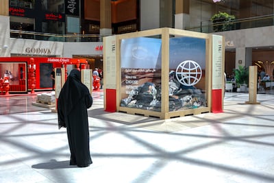 An installation in Yas Mall demonstrates the scale of annual textile waste in the UAE. Victor Besa / The National