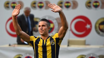 Robin Van Persie waves to fans at his official presentation as a Fenerbahce player. Ozan Kose / AFP