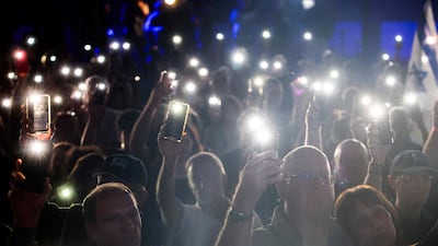 Supporters of the Yashar party led by Gadi Eisenkot, Israel's former military chief of staff, light up their phones as they attend the party's final campaign rally before the legislative election in Tel Aviv. AFP