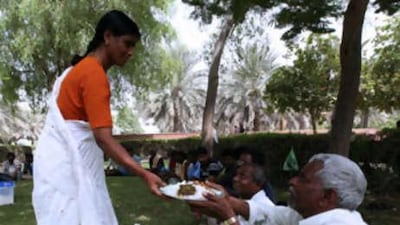 Dr Devenapally Shashikala provides food and other assistance to men at Karama Park in Dubai.
