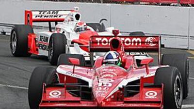 Dario Franchitti leads Ryan Briscoe's Penske during Sunday's Indycar race in Toronto, which the Briton won for his third success of the season. He now leads the championship standings.