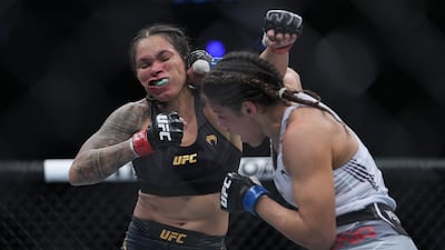 Julianna Pena moves in with a hit against Amanda Nunes. Reuters