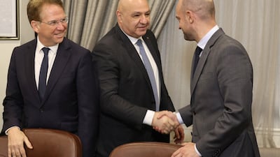 Lebanese President Joseph Aoun, centre, greets French Foreign Minister Jean-Noel Barrot, right, as Patrick Durel, France's ambassador to Lebanon, looks on during a meeting in Beirut. AFP