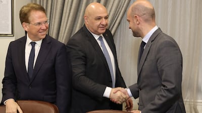 Lebanese President Joseph Aoun, centre, greets French Foreign Minister Jean-Noel Barrot, right, as Patrick Durel, France's ambassador to Lebanon, looks on during a meeting in Beirut. AFP