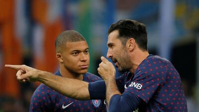 Gianluigi Buffon, right, alongside Kylian Mbappe before Paris Saint-Germain's Ligue 1 match against Lille on Saturday. Reuters