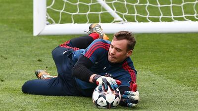 Goalkeeper Manuel Neuer makes a save during their FC Bayern Muenchen training at the Santiago Bernabeu Stadium ahead of the UEFA Champions League semi-final first leg match against Real Madridon April 22, 2014 in Madrid, Spain. Martin Rose/Bongarts/Getty Images