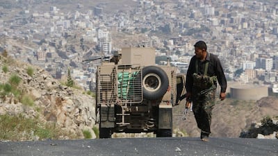 Tribal fighters take position on a street during fighting with Shiite rebels known as Houthis, in the outskirts of Taiz, Yemen. Abdulnasser Alseddik / AP Photo