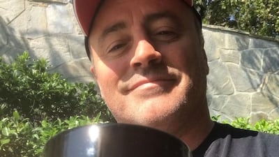 Matt LeBlanc, who played Joey in 'Friends', holds a 'Could I be wearing any more clothes' mug from the limited edition Cast Collection of merchandise