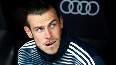 Real Madrid's Gareth Bale looks on from the bench before the match against Real Betis. Real Madrid lost the match 2-0 with Bale remaining on the bench throughout. Reuters