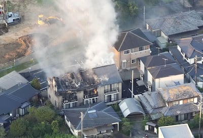 Homes on fire in Yatsushiro, Kumamoto prefecture. Kyodo / via Reuters
