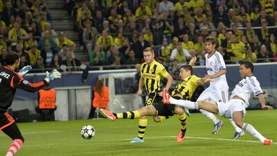 What will it be? A parting souvenir for Dormund or welcome gift for Bayern from Robert Lewandowski, centre. AFP