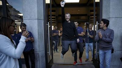 Alex Torodache, one of the first customers to buy iPhone 7 celebrates at Puerta del Sol Apple Store in Madrid, on September 16, 2016, the day the company launched the device, as well as the 7 Plus, in the city. The phones went on sale Friday in more than 25 countries. Customers started to queue 38 hours before the store opened. Gonzalo Arroyo Moreno / Getty Images