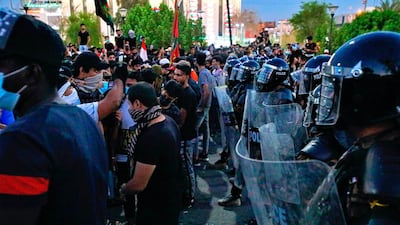 Demonstrators burned the outer gate of the entrance to the parliament building. AP