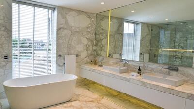 The marble bathroom is spacious with a standalone bath. The villa has been extended to nearly 8,000 square foot of built up area. Courtesy Ocean View Real Estate