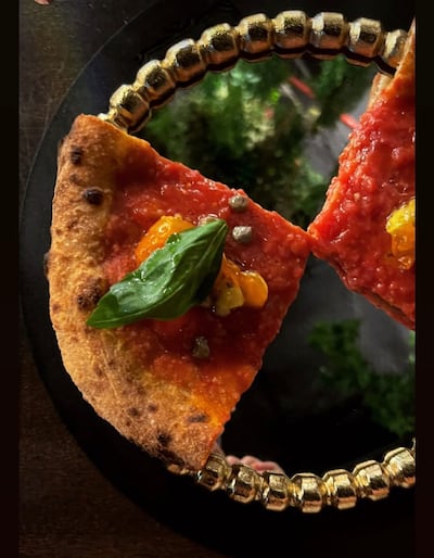 The marinara doppio crunch pizza comes on twice-cooked dough. Photo: Via Toledo Dubai
