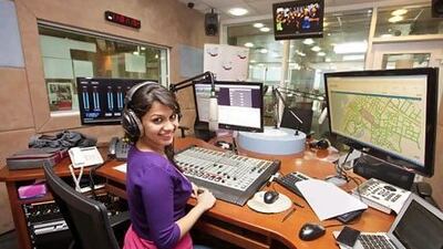 A growing number of people are tuning into Arabian Radio Network's stations online. Above, Karishma Fernandez, a presenter for City 1016, part of the network. Jaime Puebla / The National