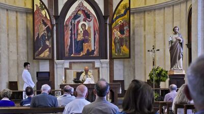 Worshippers attend the Sunday mass at the Roman Orthodox Saint Elias church in the northern Syrian city of Aleppo. Churches in Aleppo reopened after being closed down in a bid to limit the spread of coronavirus. AFP