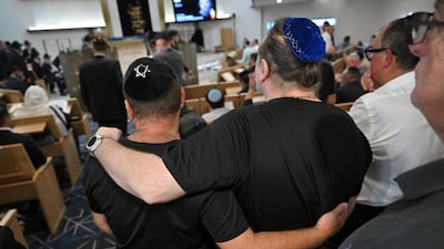 Mourners gather at the Chabad of Bondi synagogue during the funeral of Rabbi Eli Schlanger. Reuters