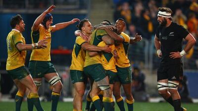 Australia celebrate with Nick White after he scored a try during The Rugby Championship match against New Zealand. Mark Kolbe / Getty Images
