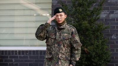 Leader of South Korean K-pop boyband Big Bang G-Dragon poses for photographs after being discharged from army in Yongin, South Korea, October 26, 2019. REUTERS/Heo Ran