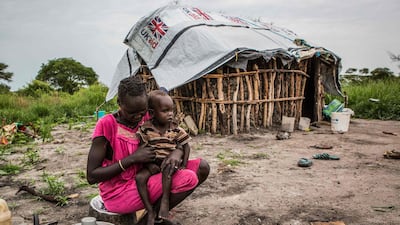 A woman cooking maize in Jeich village in Ayod County, northern South Sudan. PATRICK MEINHARDT / AFP