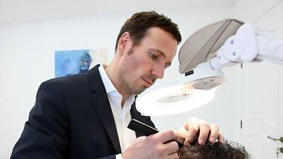 Lars Skjøth, the founder of the Hårklinikken hair loss treatment clinic, does all diagnoses of scalp and hair personally. Pawan Singh / The National