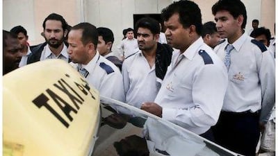 Tawasul taxi drivers gather near their camp before appearing in Labour Court yesterday.