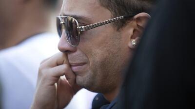 David Sotomayor, who is a cousin of Orlando shooting victim Edward Sotomayor, is emotional during a vigil for the victims of the Orlando nightclub shooting, in the Boystown neighborhood of Chicago. Erin Hooley / Chicago Tribune via AP