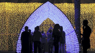 People at the Palm Oasis near Al Noor Masjid during the Sharjah Light Festival in Sharjah. Pawan Singh / The National