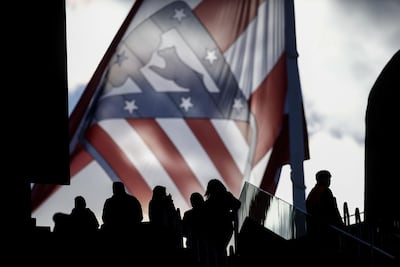 A giant Atletico Madrid flag waves behind the fans at the Wanda Metropolitano before Atletico Madrid's game against Real Sociedad. Gonzalo Arroyo Moreno / Getty Images