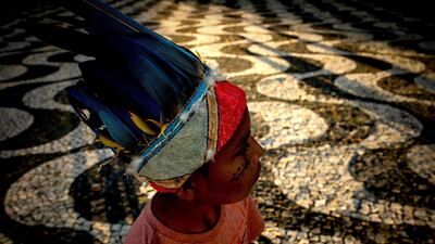 An child looks on during a demonstration held by indigenous peoples in Manaus, Brazil. EPA