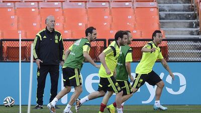 Spain coach Vicente del Bosque watches some of his Spain players during a training session on Tuesday in Washington, DC, USA ahead of the 2014 World Cup. Shawn Thew / EPA / June 3, 2014