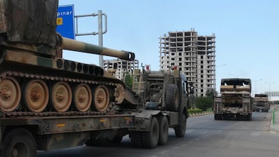 A convoy of Turkish vehicles carrying tanks destined for Syria, near the town of Kilis in Turkey. AP