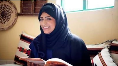 Shahad Al Yafaei poses for a portrait with a book at her mother's home in Sharjah. Shahad is getting her Masters in Public Health whilst working a morning job and taking care of her 2 year-old daughter. Razan Alzayani / The National