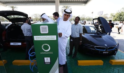An electric car charging station at Dubai Electricity and Water Authority's HQ in Garhoud, Dubai. The government is one of the biggest buyers of electric cars - and there are plans to drive up private ownership too. Pawan Singh / The National
