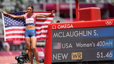 Sydney Mclaughlin, of United States, celebrates after winning the gold medal in the final of the the women's 400-meter hurdles and setting a new world record.