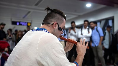 A performer plays a pipe before a busy crowd this week. Courtesy: Dubai Media Office