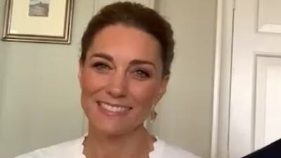 The duchess wears a white scalloped Sandro cardigan for a Zoom call with volunteers from the charity Shout on May 15. She is credited with search interest in scalloped cardigans. Instagram / Kensington Royal