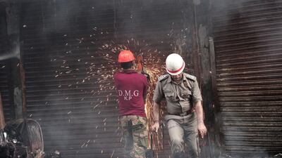 Firefighters attempt to cut the fire off. EPA