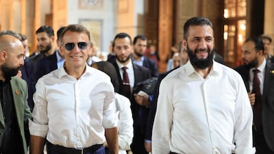 French President Emmanuel Macron and Syrian President Ahmad Al Shara at the Umayyad Mosque in Damascus on Monday. AFP
